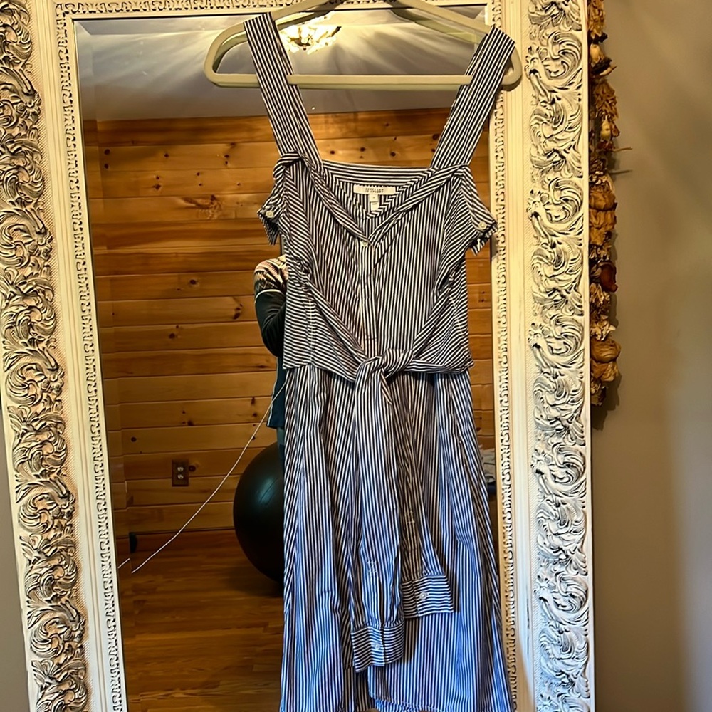 Worn once. Really stylish and unique shirt dress.  Just needs some ironing.